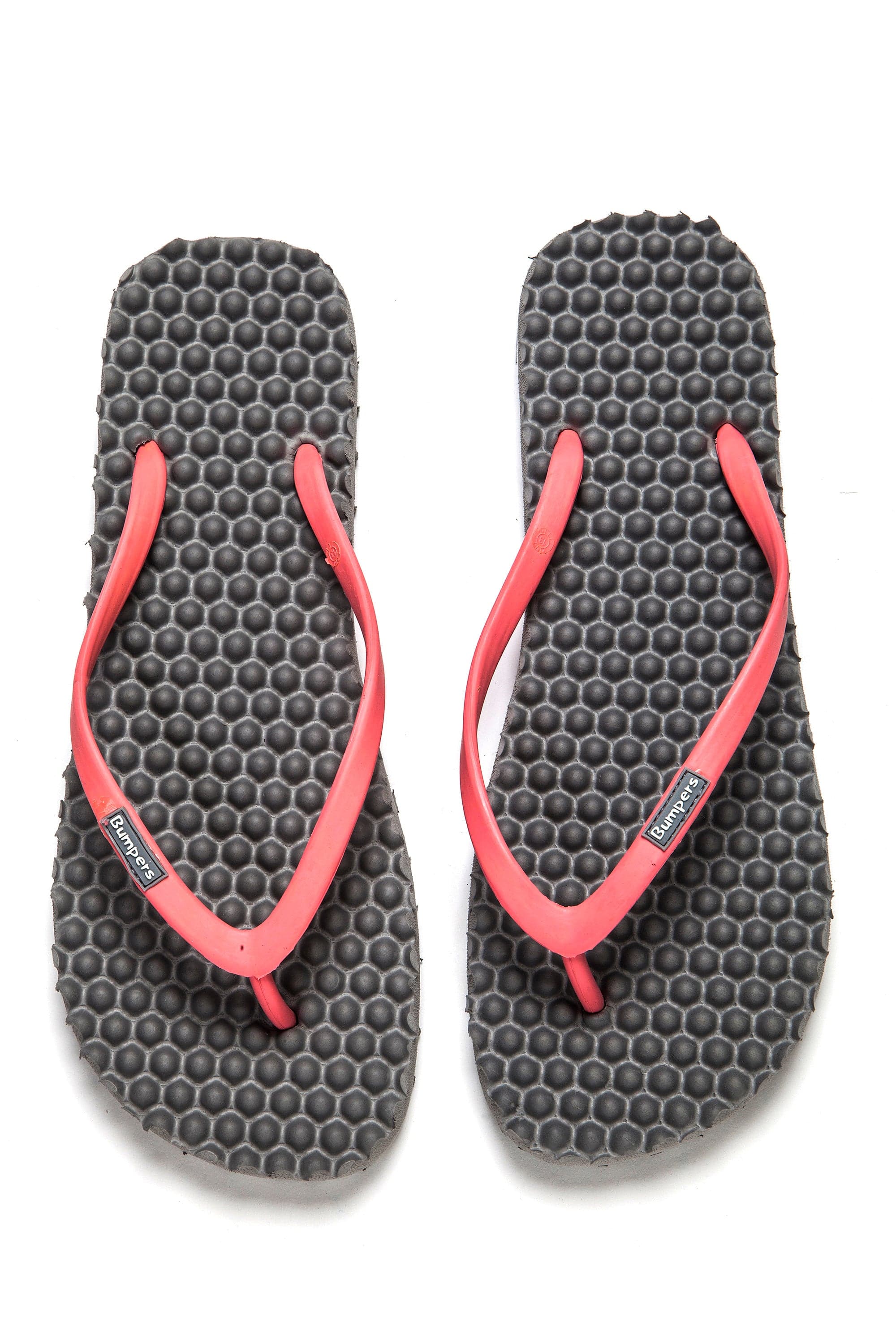 Pair of gray Bumpers Slim sandals with pink straps shown completely from above