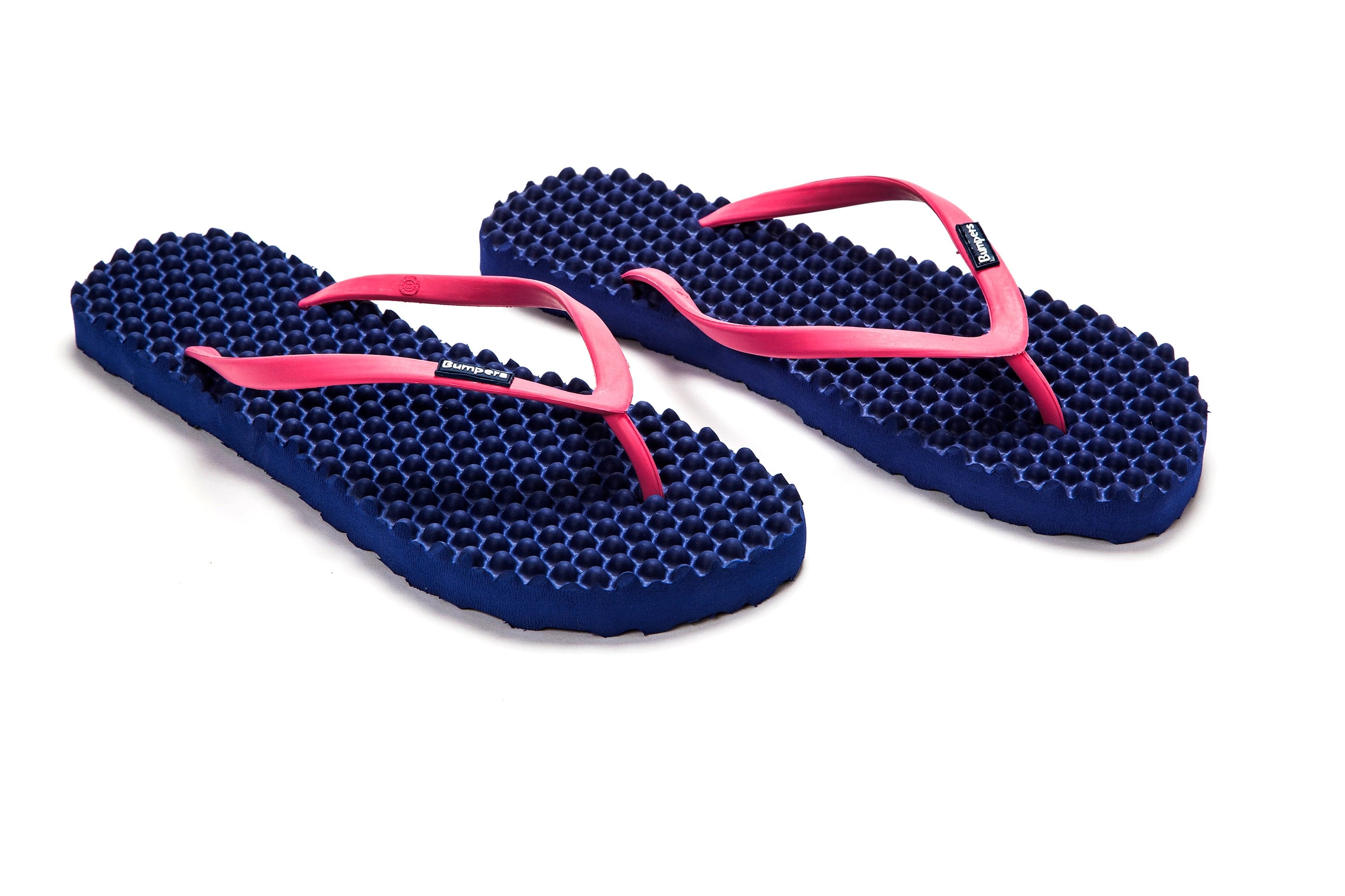 Pair of navy Bumpers Slim sandals with pink straps shown completely at an angle