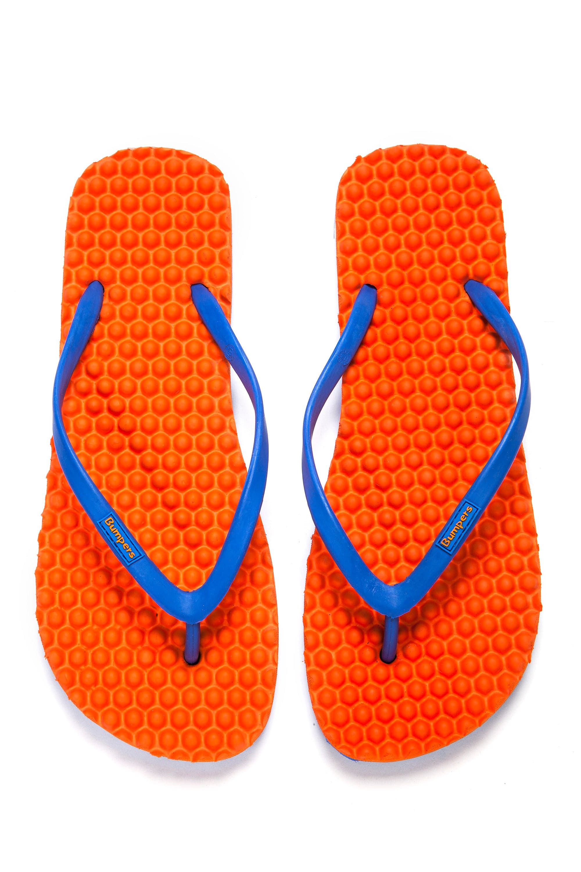 Pair of orange Bumpers Slim sandals with blue straps shown completely from above