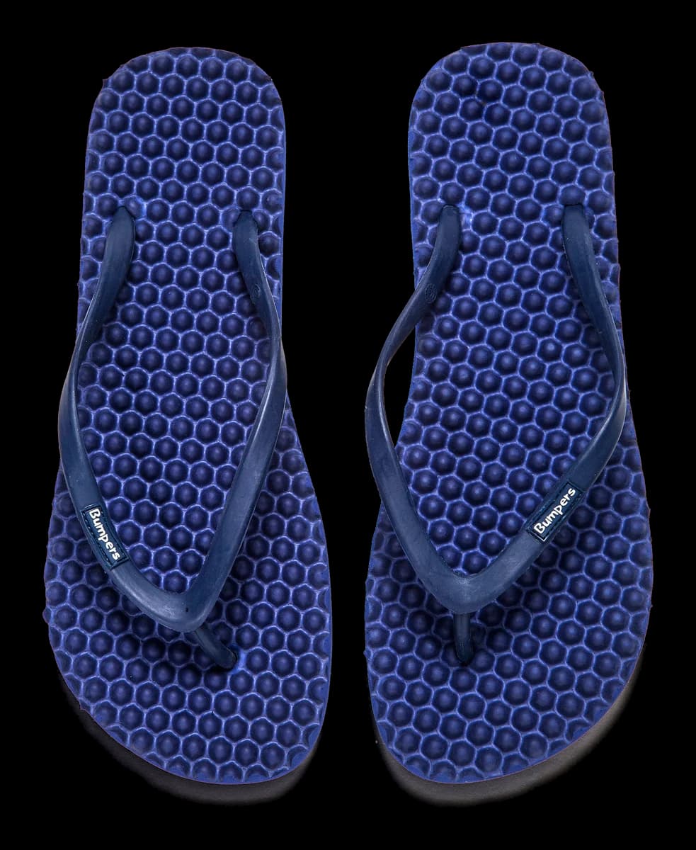 Pair of navy Bumpers Slim sandals photographed completely from above